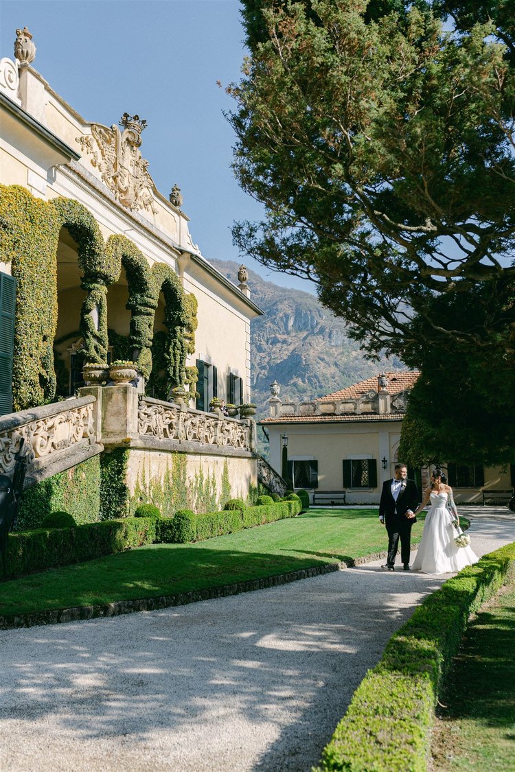 A couple in front of the villa