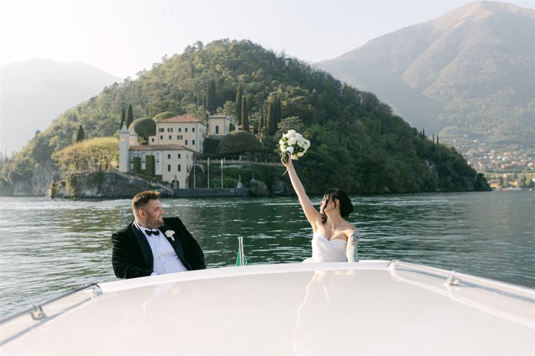 Celebrating on the boat in front of the promontory
