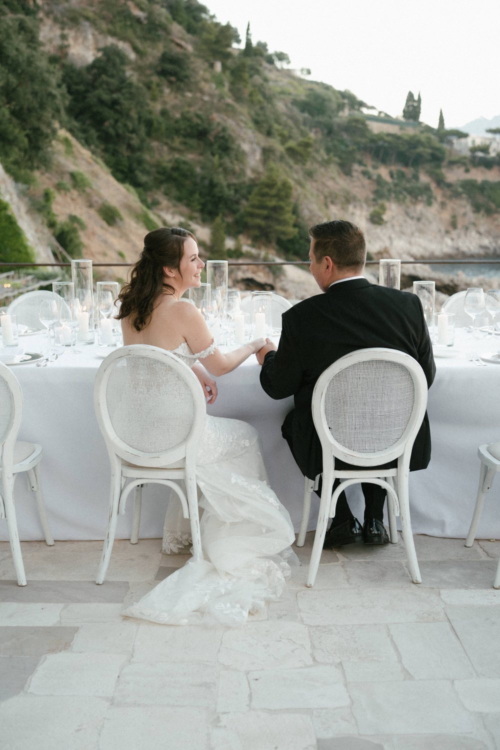 A couple at their table on the terrace