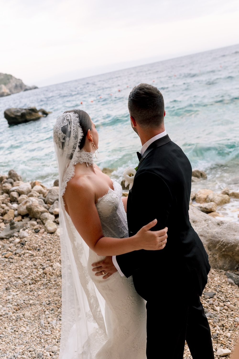 An embrace by the water