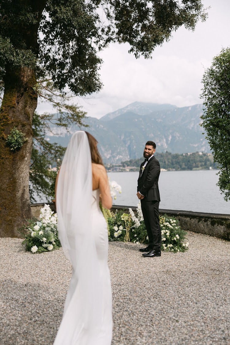 A bride on the terrace, looking out over the lake