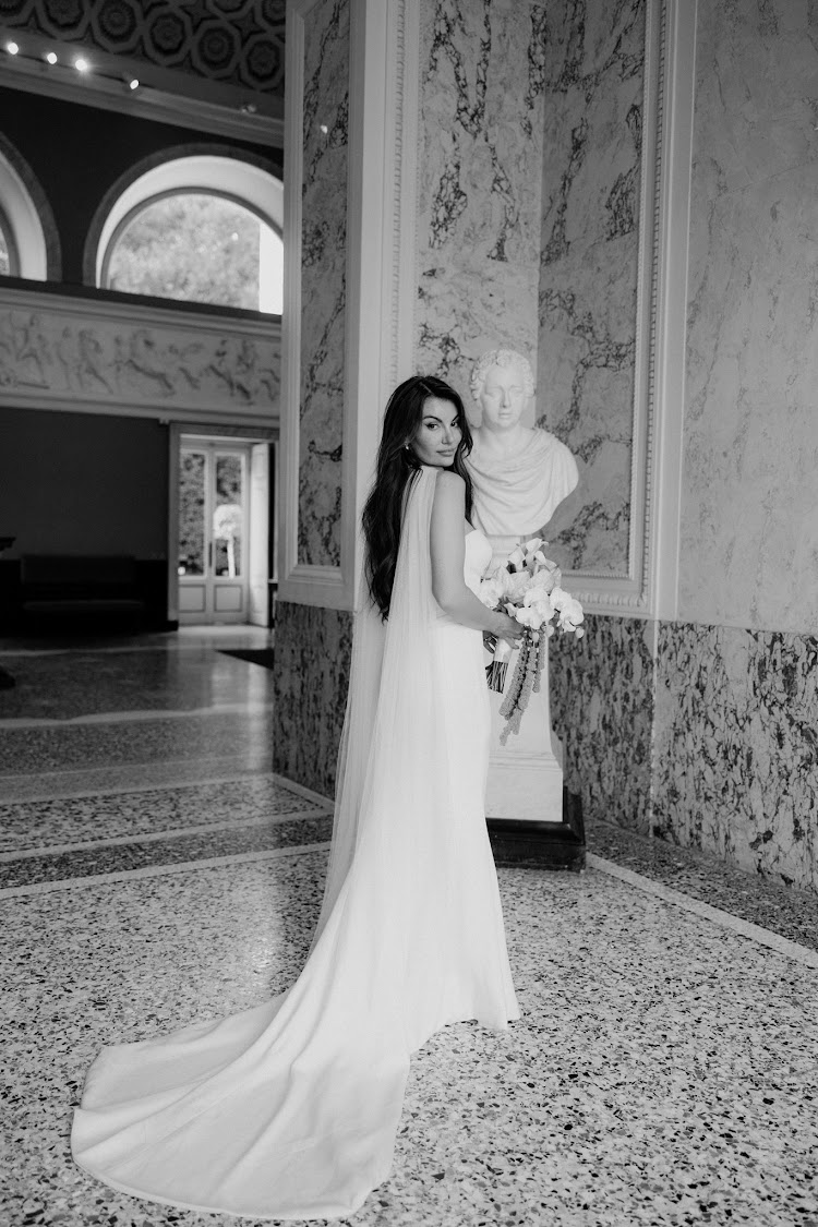 A bride in the marble halls of the villa