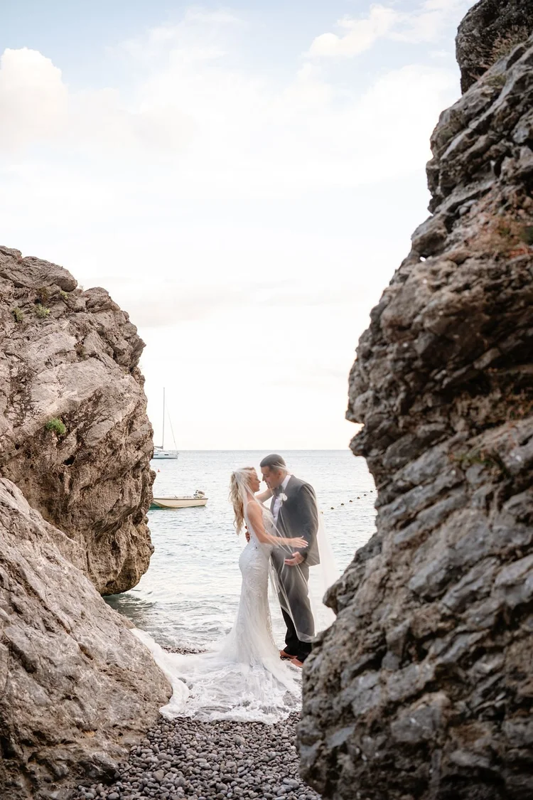 A bride on the rocks by the sea