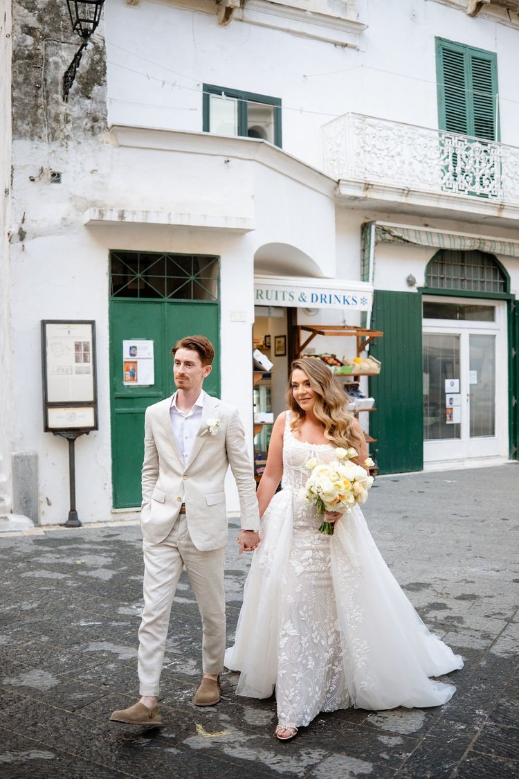 A couple walking through a piazza in Ravello