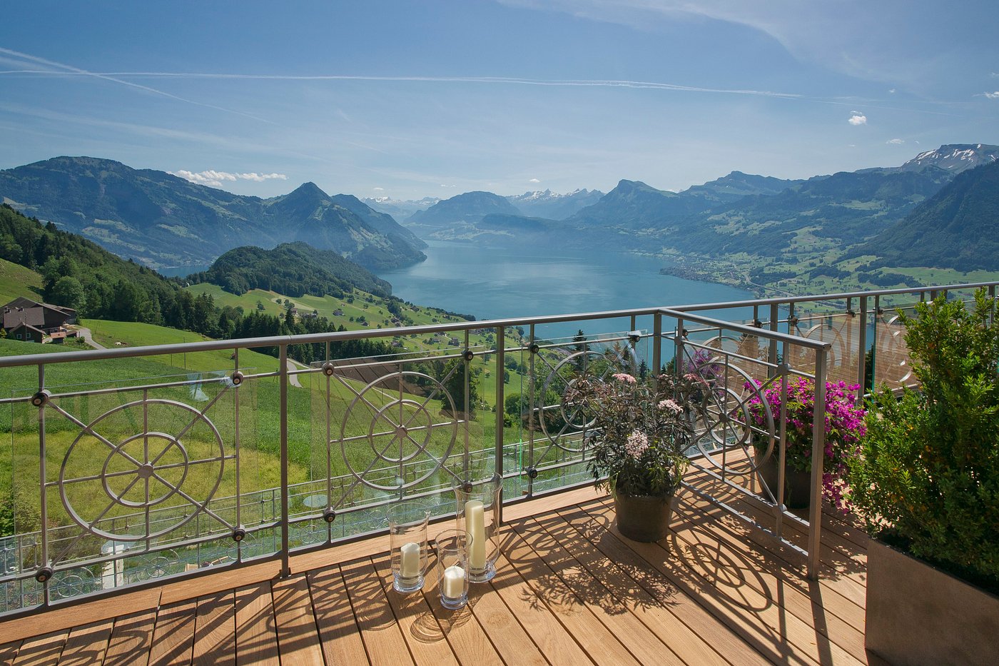 A suite terrace at Hotel Villa Honegg with Lake Lucerne and the Swiss Alps beyond