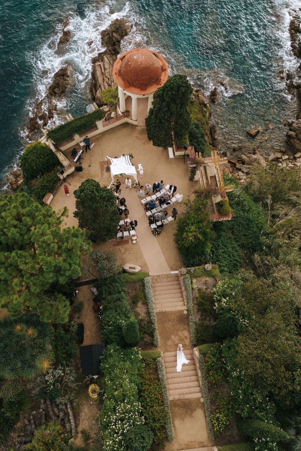 Aerial view of a ceremony set up in the gardens of Marimurtra Botanic Gardens above the sea in Blanes, Costa Brava