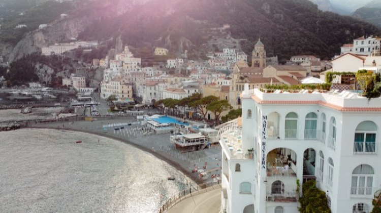 Hotel Marina Riviera, a white arched building next to the beach in Amalfi