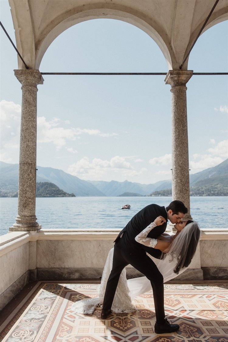 A kiss under the arches, just married