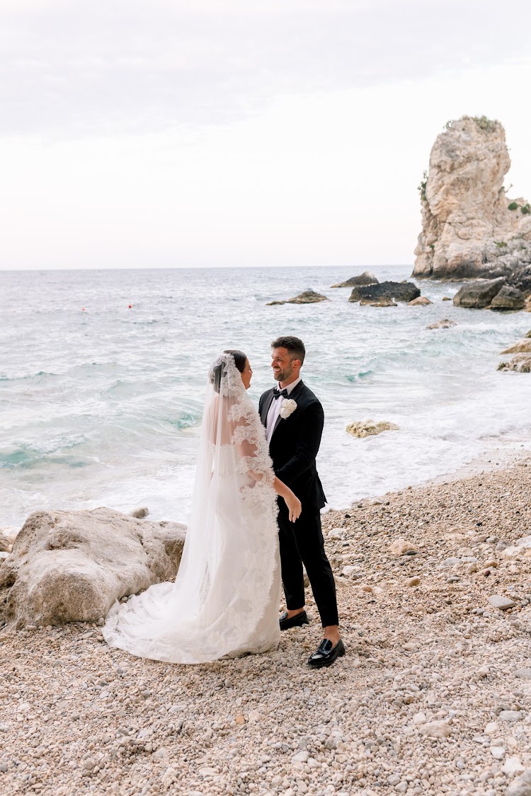 A beach ceremony below the cliffs of Taormina — already designed elopement, Sicily