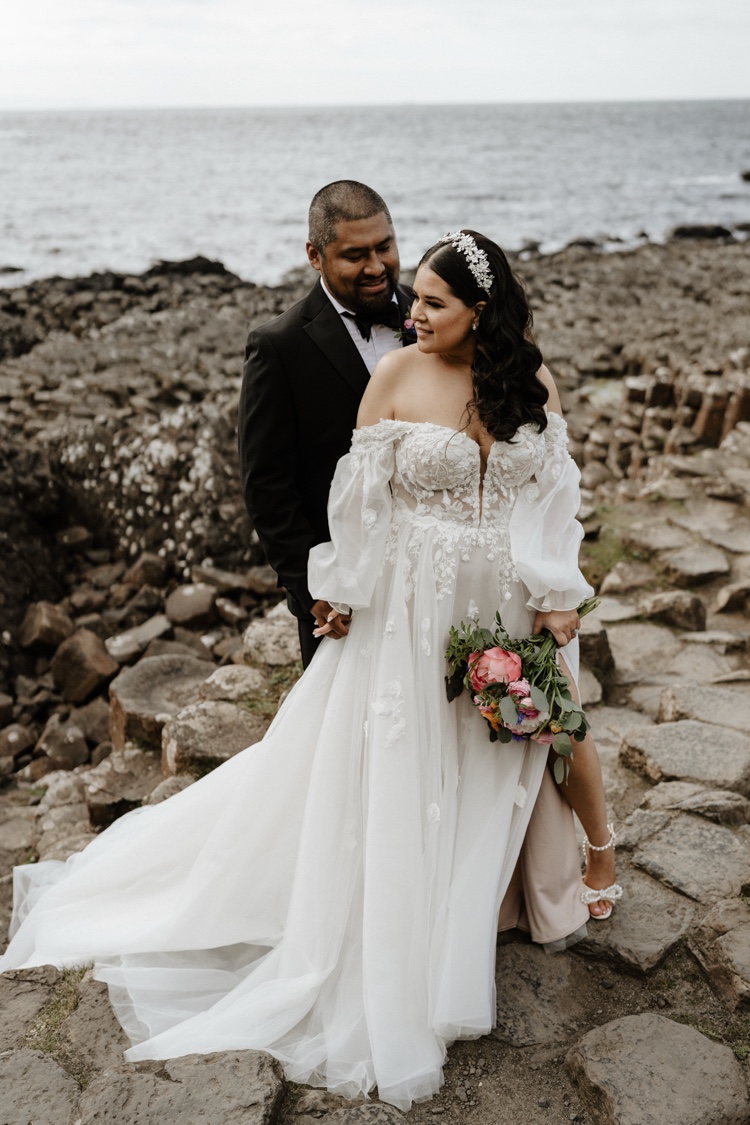 Elope on a clifftop field facing Dunluce Castle, Northern Ireland, already designed elopement, Northern Ireland