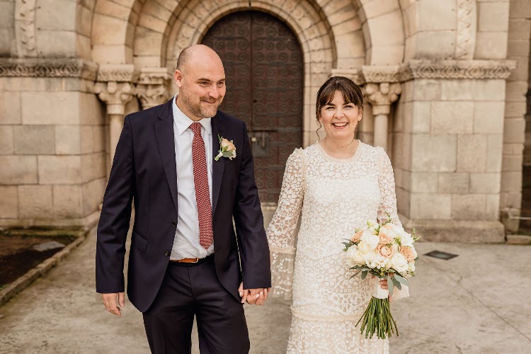 A couple walking together by the monastery portal at Poble Espanyol in Barcelona