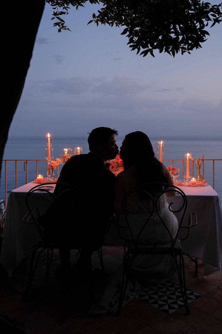 A private dinner at dusk above the sea