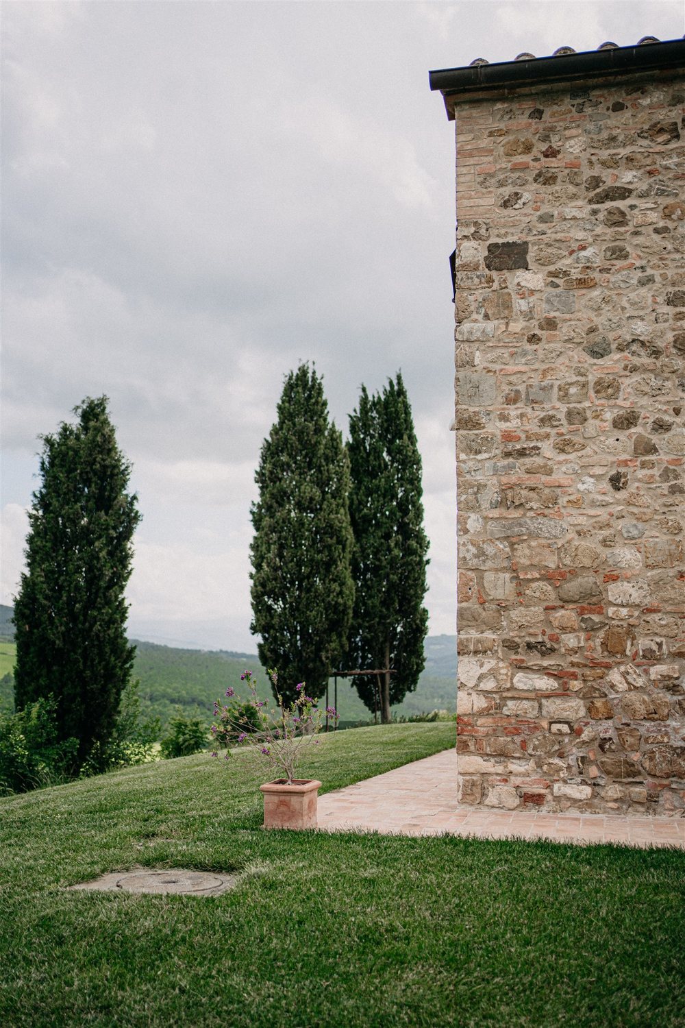 Cypress trees beside the farmhouse tower